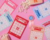 Cheesy Movie Bingo (Updated Format) by Your Gal Kiwi—Rom-Com-Notepad Games-And Here We Are